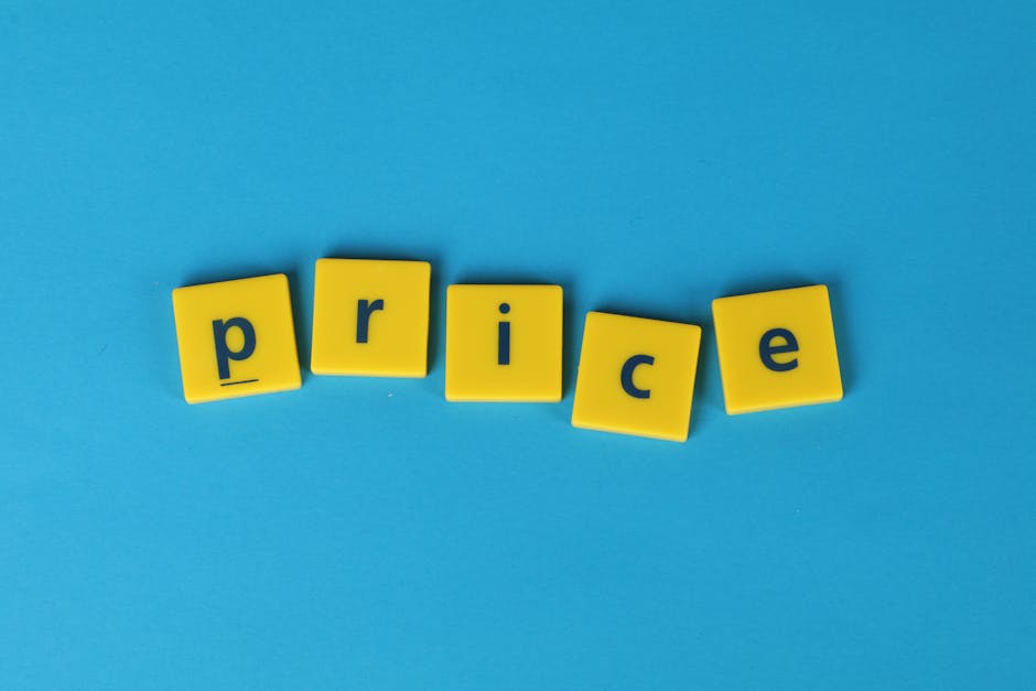 An arrangement of five yellow plastic letter tiles spelling out the word 'price' is positioned on a flat, bright blue surface. Each tile has a smooth, matte finish with rounded edges and a navy blue l